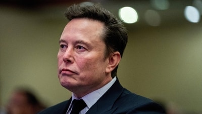 Tesla CEO and X owner Elon Musk listens as US President-elect Donald Trump speaks during a meeting with House Republicans at the Hyatt Regency hotel in Washington, DC, U.S. on November 13, 2024.  ALLISON ROBBERT/Pool via REUTERS/File Photo (via REUTERS)