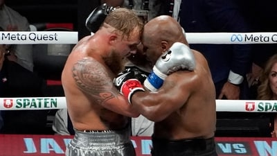 US YouTuber/boxer Jake Paul (L) and US retired pro-boxer Mike Tyson (R) hug at the end of their heavyweight boxing bout at The Pavilion at AT&T Stadium in Arlington, Texas, November 15, 2024. (Photo by TIMOTHY A. CLARY / AFP) (AFP) US YouTuber/boxer Jake Paul (L) and US retired pro-boxer Mike Tyson (R) hug at the end of their heavyweight boxing bout at The Pavilion at AT&T Stadium in Arlington, Texas, November 15, 2024. (Photo by TIMOTHY A. CLARY / AFP) (AFP)
