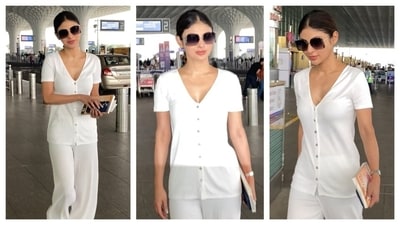 For her airport look, Mouni Roy opted for a monochrome co-ord set that entails a fitted buttoned-down top with a deep, v-neckline and flowy pants. She paired it with oversized sunglasses and aced the minimalist chic aesthetic. (PC: Ashutosh Rai) For her airport look, Mouni Roy opted for a monochrome co-ord set that entails a fitted buttoned-down top with a deep, v-neckline and flowy pants. She paired it with oversized sunglasses and aced the minimalist chic aesthetic. (PC: Ashutosh Rai)