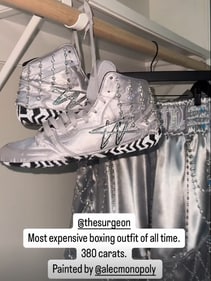 Jake Paul's diamond-encrusted boxing shoes come with a $1 million price tag, while his shorts feature exclusive original artwork by Alec Monopoly, making him a walking work of art in the ring (Instagram/Jake Paul) Jake Paul's diamond-encrusted boxing shoes come with a $1 million price tag, while his shorts feature exclusive original artwork by Alec Monopoly, making him a walking work of art in the ring (Instagram/Jake Paul)