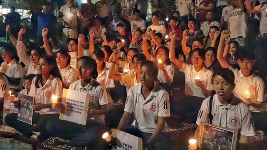 Manipur community women stage a candle protest for the safe release of six abducted individuals ( saikat paul)