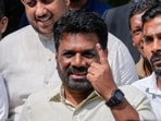 Sri Lankan President Anura Kumara Dissanayake shows his finger as he leaves after casting his vote during the parliamentary election in Colombo, Sri Lanka, Thursday, Nov. 14, 2024.