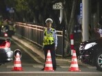 A security personnel stands guard near a sports center where a man rammed a car into people exercising in Zhuhai, China on Monday. A security personnel stands guard near a sports center where a man rammed a car into people exercising in Zhuhai, China on Monday.