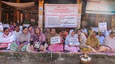 Women from Lamlai village and Chalou village stage a sit-in protest in Imphal East against the violence and tension in the state after the kidnapping of 6 individuals. (ANI Photo) (ANI) Women from Lamlai village and Chalou village stage a sit-in protest in Imphal East against the violence and tension in the state after the kidnapping of 6 individuals. (ANI Photo) (ANI)