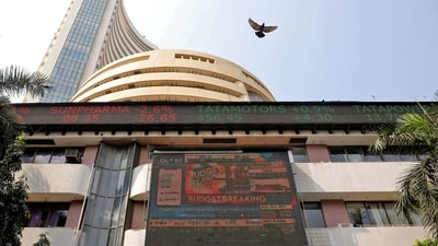 A bird flies past a screen displaying the Sensex results on the facade of the Bombay Stock Exchange (BSE) building in Mumbai. (REUTERS)