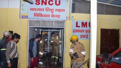 Firefighters work after a fire broke out in a neonatal intensive care unit at Jhansi Medical College hospital, in Jhansi. (AP) Firefighters work after a fire broke out in a neonatal intensive care unit at Jhansi Medical College hospital, in Jhansi. (AP)