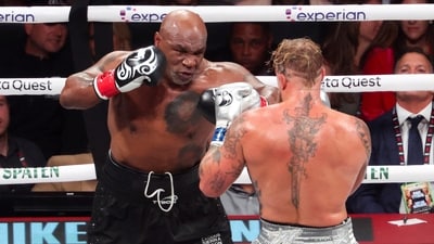 Mike Tyson (black gloves) fights Jake Paul (silver gloves) at AT&T Stadium. (USA TODAY Sports via Reuters Con)