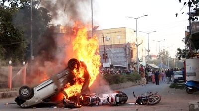 Smoke and flames billow out of vehicles which were set on fire during demonstrations after three bodies, suspected to be of six missing persons from Jiribam district were found near the Manipur-Assam border on Friday nighT in Imphal. (PTI Photo) (PTI) Smoke and flames billow out of vehicles which were set on fire during demonstrations after three bodies, suspected to be of six missing persons from Jiribam district were found near the Manipur-Assam border on Friday nighT in Imphal. (PTI Photo) (PTI)