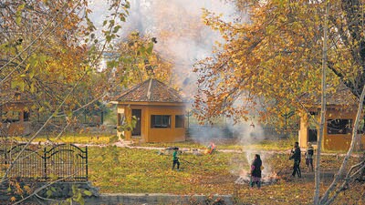 People burn fallen leaves in autumn to make charcoal for use during winter in Srinagar. (AP)