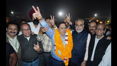 Sunil Khanna, 62, an industrialist, celebrating his win with his supporters at Chandigarh Club on Sunday. (HT Photo)