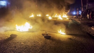 Tyres set on fire by people protesting after bodies of six people from the Meitei community were found, days after they were taken hostage by suspected Kuki insurgents from Manipur's Jiribam district, Saturday night. (PTI) Tyres set on fire by people protesting after bodies of six people from the Meitei community were found, days after they were taken hostage by suspected Kuki insurgents from Manipur's Jiribam district, Saturday night. (PTI)