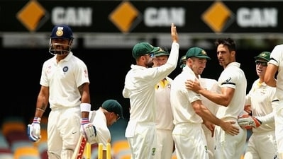 Mitchell Johnson celebrates as Virat Kohli looks on. (Getty) Mitchell Johnson celebrates as Virat Kohli looks on. (Getty)