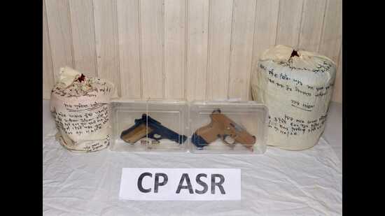 Police seized 3.5kg heroin, 1.5kg methaqualone and two pistols, including one sophisticated 9mm Glock. (HT Photo)