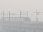 A Metro train passes amid the thick layers of smog at Mayur Vihar Phase -1 in New Delhi. A Metro train passes amid the thick layers of smog at Mayur Vihar Phase -1 in New Delhi.