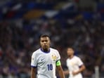 France's forward #10 Kylian Mbappe looks on during a match. France's forward #10 Kylian Mbappe looks on during a match.