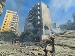 Lebanese firefighters put out a fire at the site of an Israeli airstrike that targeted Beirut's southern suburbs neighborhood of Haret Hreik. Lebanese firefighters put out a fire at the site of an Israeli airstrike that targeted Beirut's southern suburbs neighborhood of Haret Hreik.