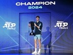 Italy's Jannik Sinner poses with the trophy after winning the final against USA's Taylor Fritz at the ATP Finals tennis tournament in Turin on November 17, 2024 Italy's Jannik Sinner poses with the trophy after winning the final against USA's Taylor Fritz at the ATP Finals tennis tournament in Turin on November 17, 2024