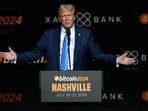 FILE PHOTO: Republican presidential nominee and former U.S. President Donald Trump gestures at the Bitcoin 2024 event in Nashville, Tennessee, U.S., July 27, 2024. REUTERS/Kevin Wurm/File Photo