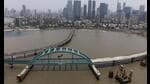 FILE PHOTO: FILE PHOTO: A drone view shows a bowstring arch bridge, installed by Hindustan Construction Company, that will connect the Bandra-Worli sea link and the coastal road in Mumbai, India, April 26, 2024. REUTERS/Francis Mascarenhas/File Photo/File Photo (REUTERS)
