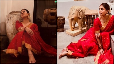&nbsp;Nayanthara looks nothing short of dreamy in a red silk saree adorned with golden borders. Paired with a matching blouse, jhumka earrings, and gajra-adorned hair, she exudes elegance. (Instagram)