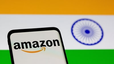 Smartphone with Amazon logo is seen in front of displayed Indian flag in this illustration taken, July 30, 2021. (Dado Ruvic/Reuters)
