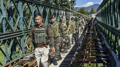 Assam Rifles officers at Lailophai in Churachandpur district of Manipiur on Monday. (PTI) Assam Rifles officers at Lailophai in Churachandpur district of Manipiur on Monday. (PTI)
