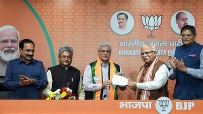BJP leader and Union minister Manohar Lal Khattar presents party membership slip to Kailash Gahlot at BJP headquarters in New Delhi on Monday. (ANI) BJP leader and Union minister Manohar Lal Khattar presents party membership slip to Kailash Gahlot at BJP headquarters in New Delhi on Monday. (ANI)