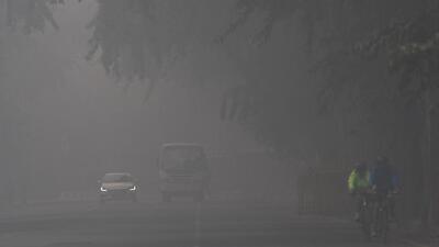 Commuters travel through a hazy road amid thick smog in New Delhi. (ANI Photo) Commuters travel through a hazy road amid thick smog in New Delhi. (ANI Photo)