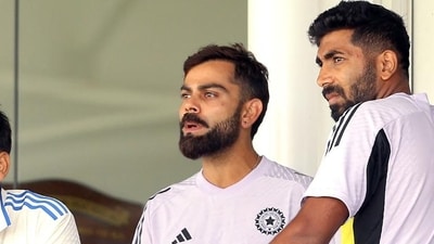India players Virat Kohli and Jasprit Bumrah watch the internal practice match in Perth. (AFP) (HT_PRINT) India players Virat Kohli and Jasprit Bumrah watch the internal practice match in Perth. (AFP) (HT_PRINT)