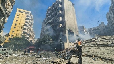 Lebanese firefighters put out a fire at the site of an Israeli airstrike that targeted Beirut's southern suburbs neighborhood of Haret Hreik. (AFP) Lebanese firefighters put out a fire at the site of an Israeli airstrike that targeted Beirut's southern suburbs neighborhood of Haret Hreik. (AFP)