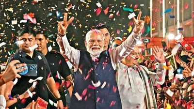 Prime Minister Narendra Modi flashes the victory sign as he arrives at the Bharatiya Janata Party (BJP) headquarters to celebrate the party’s win in general elections, on Tuesday. (AFP) Prime Minister Narendra Modi flashes the victory sign as he arrives at the Bharatiya Janata Party (BJP) headquarters to celebrate the party’s win in general elections, on Tuesday. (AFP)