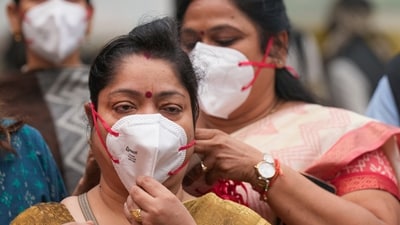 A commuter adjusts her face mask as air quality continues to remain "severe" in New Delhi. Air quality in the national capital worsened, with air pollution levels nearing 500 across several monitoring stations in Delhi. (PTI) A commuter adjusts her face mask as air quality continues to remain "severe" in New Delhi. Air quality in the national capital worsened, with air pollution levels nearing 500 across several monitoring stations in Delhi. (PTI)