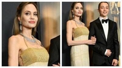 Angelina Jolie wore a golden dress with diamond necklace. The bust was of darker yellow hue, while the silhouette was straight and flowy. Her son Knox Jolie-Pitt attended the event with her. (Instagram) Angelina Jolie wore a golden dress with diamond necklace. The bust was of darker yellow hue, while the silhouette was straight and flowy. Her son Knox Jolie-Pitt attended the event with her. (Instagram)