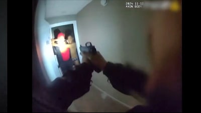 The chilling video shows the cop firing a bullet that hits the man in the head as he collapses. (X/@shanermurph) The chilling video shows the cop firing a bullet that hits the man in the head as he collapses. (X/@shanermurph)