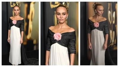 Lily-Rose Depp wore a beautiful off-shoulder gown. The top half is draped in black fabric with a flower at the centre, while the bottom flows in soft white, creating a dramatic contrast. (Instagram) Lily-Rose Depp wore a beautiful off-shoulder gown. The top half is draped in black fabric with a flower at the centre, while the bottom flows in soft white, creating a dramatic contrast. (Instagram)