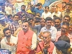 BJP leader Vinod Tawde tries to explain the case to the media after BVA workers gheraoed him for allegedly distributing cash to influence voters a day before Maharashtra Assembly polls at a hotel in Virar near Mumbai on Tuesday. (PTI)