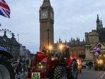 Farmers drive their tractors past the Houses of Parliament during a protest against issues including substandard food imports, in London, UK, on Monday, Farmers drive their tractors past the Houses of Parliament during a protest against issues including substandard food imports, in London, UK, on Monday,