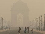 Women walk on a road near India Gate as the sky is enveloped with smog after Delhi's air quality worsened due to air pollution, in New Delhi, India, on Tuesday. (REUTERS) Women walk on a road near India Gate as the sky is enveloped with smog after Delhi's air quality worsened due to air pollution, in New Delhi, India, on Tuesday. (REUTERS)