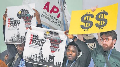 Activists participate in a demonstration for climate finance at the COP29 UN Climate Summit, on Tuesday, in Baku, Azerbaijan. (AP) Activists participate in a demonstration for climate finance at the COP29 UN Climate Summit, on Tuesday, in Baku, Azerbaijan. (AP)