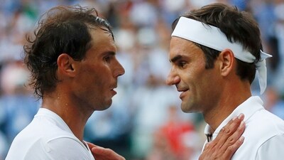Roger Federer shakes hands and embraces Spain's Rafael Nadal. (AFP) Roger Federer shakes hands and embraces Spain's Rafael Nadal. (AFP)