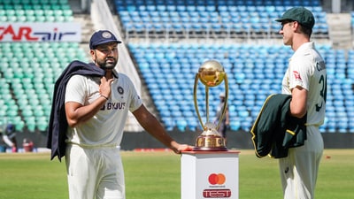 Indian captain Rohit Sharma interacts with his Australian counterpart Pat Cummins (PTI)