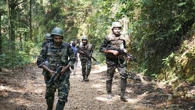 Security personnel during a combing operation in Kabbinale forest area in Udupi district on Tuesday. (PTI) Security personnel during a combing operation in Kabbinale forest area in Udupi district on Tuesday. (PTI)