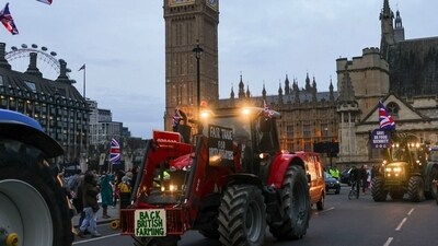Farmers drive their tractors past the Houses of Parliament during a protest against issues including substandard food imports, in London, UK, on Monday, (Bloomberg) Farmers drive their tractors past the Houses of Parliament during a protest against issues including substandard food imports, in London, UK, on Monday, (Bloomberg)