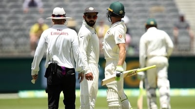 Virat Kohli of India and Tim Paine of Australia bump into each other during day four of the second Test at Perth Stadium on December 17, 2018. (Getty Images) Virat Kohli of India and Tim Paine of Australia bump into each other during day four of the second Test at Perth Stadium on December 17, 2018. (Getty Images)