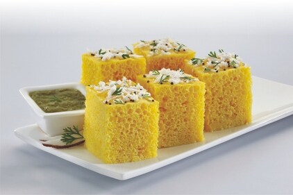 Dhokla, made from fermented lentils and chickpea flour, is another nutritious option when prepared with minimal oil. (Pinterest) Dhokla, made from fermented lentils and chickpea flour, is another nutritious option when prepared with minimal oil. (Pinterest)