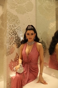 Shalini Passi stuns in a deep pink, embellished gown from Jenny Packham featuring a daring plunging neckline, radiating elegance,