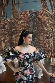 Shalini Passi looks vibrant in floral off-shoulder dress from Oscar de la Renta featuring bold, voluminous sleeves.
