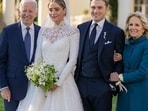 Naomi posing with her grandparents and her husband, Peter Neal, at her wedding in 2022