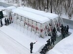 Emergency personnel walk into radiation-resistant mobile bomb shelters in Nizhny Novgorod region.