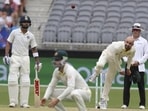 Australia's Nathan Lyon bowls, watched by India's Virat Kohli (left) Australia's Nathan Lyon bowls, watched by India's Virat Kohli (left)